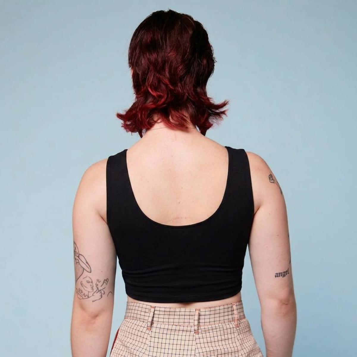Rear view of a black cropped chest binder