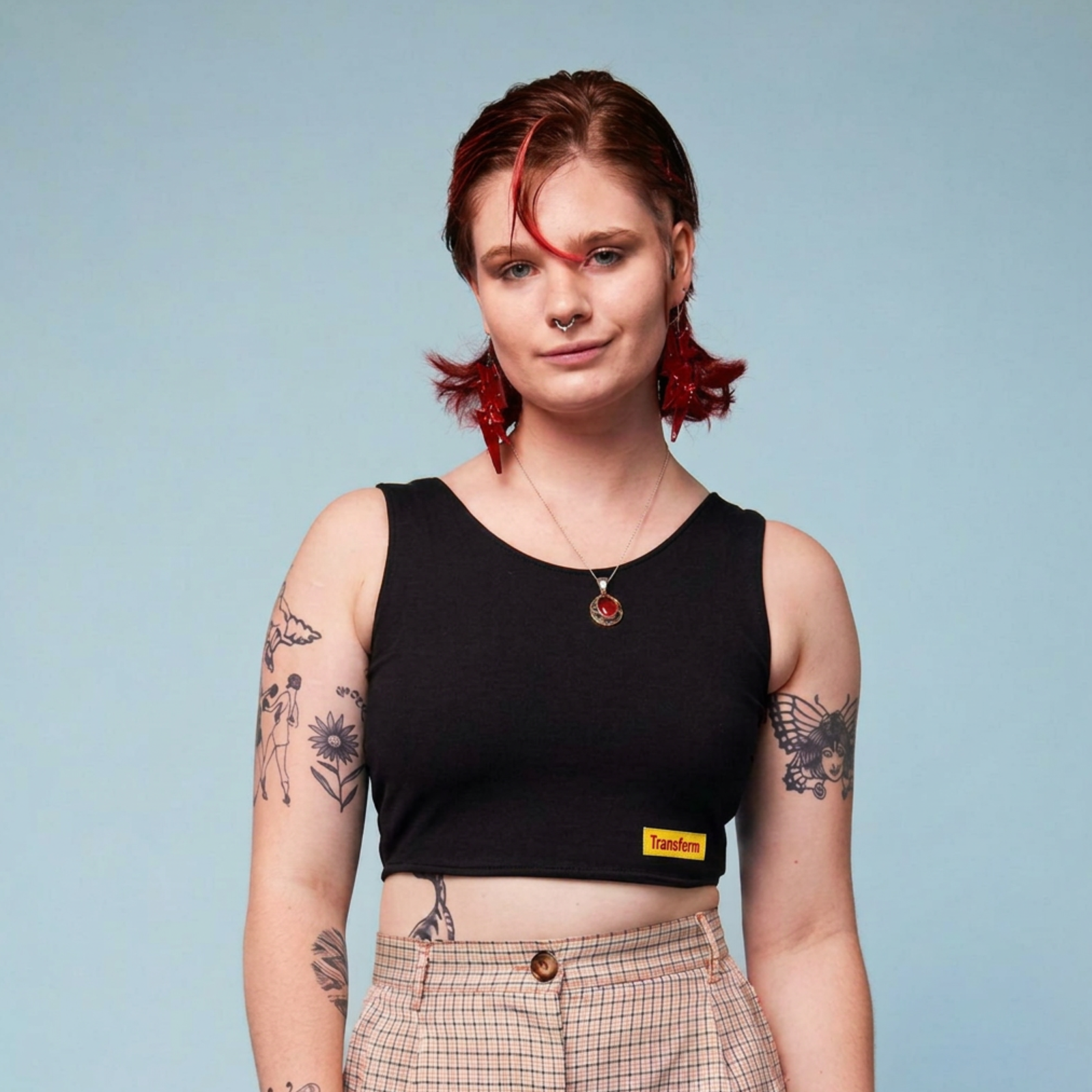 Model wearing a black crop chest binder