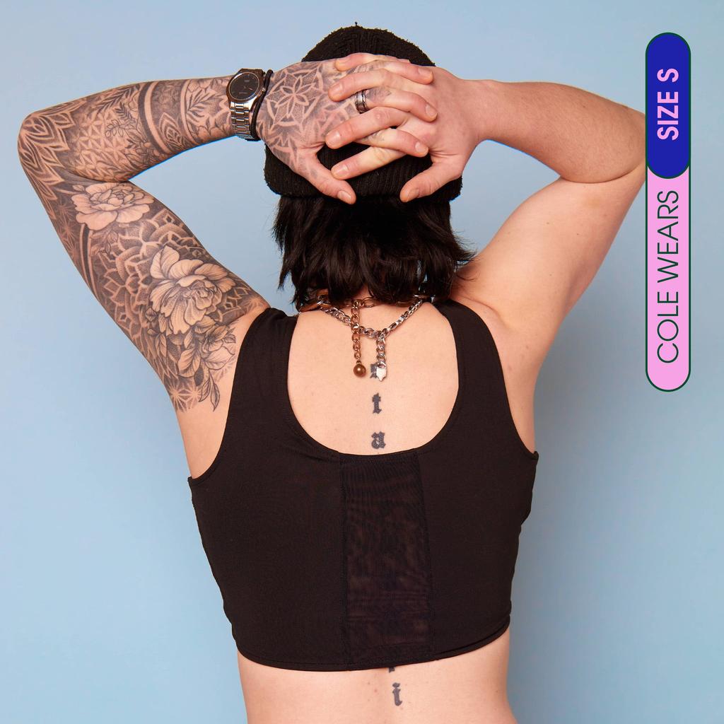 Wei wearing our maximum compression, adjustable and breathable chest binder - Rear View with breathable panel