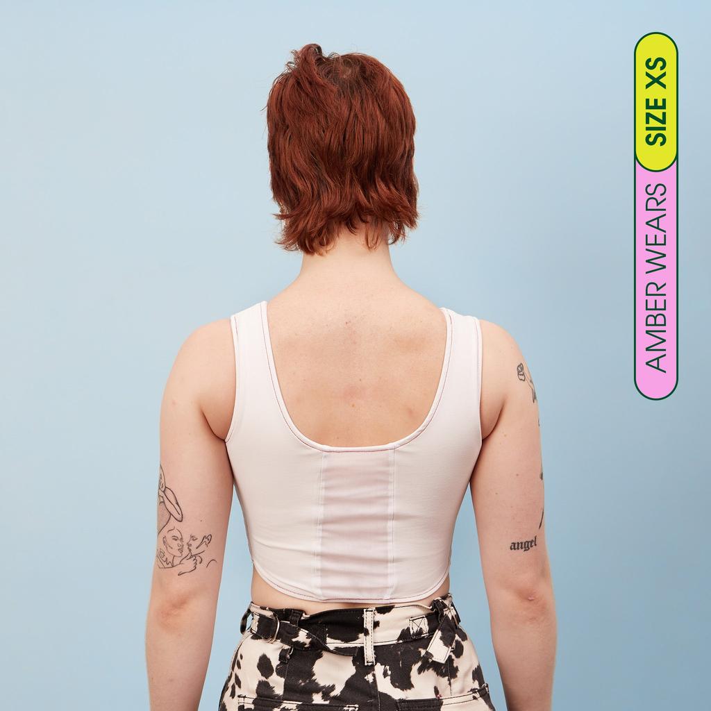 Amber wearing our maximum compression, adjustable and breathable chest binder - Rear view of our Chest Binder Crop showing breathable panel