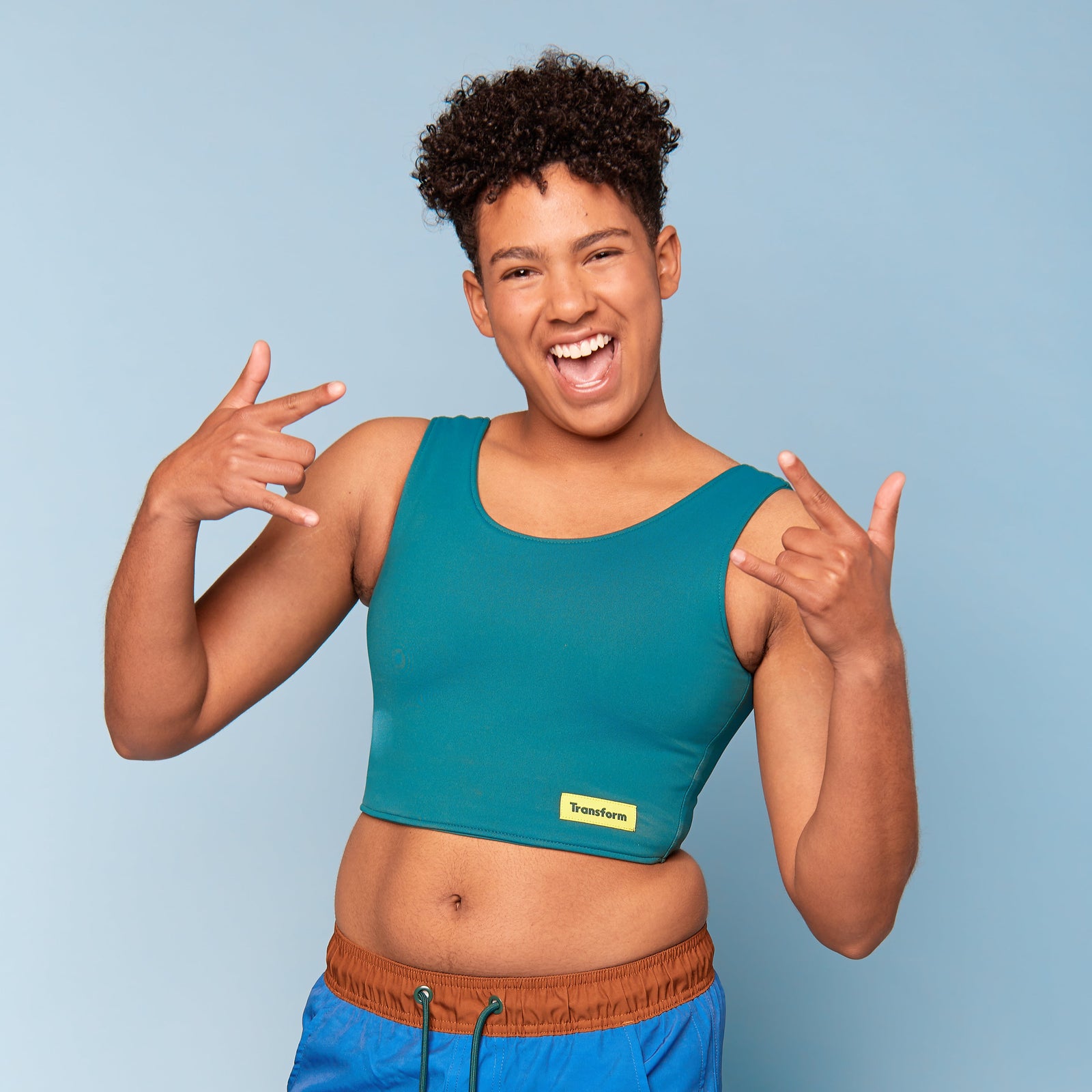 Tobi is wearing ftm Swim Binder - Crop Moss Green - front view