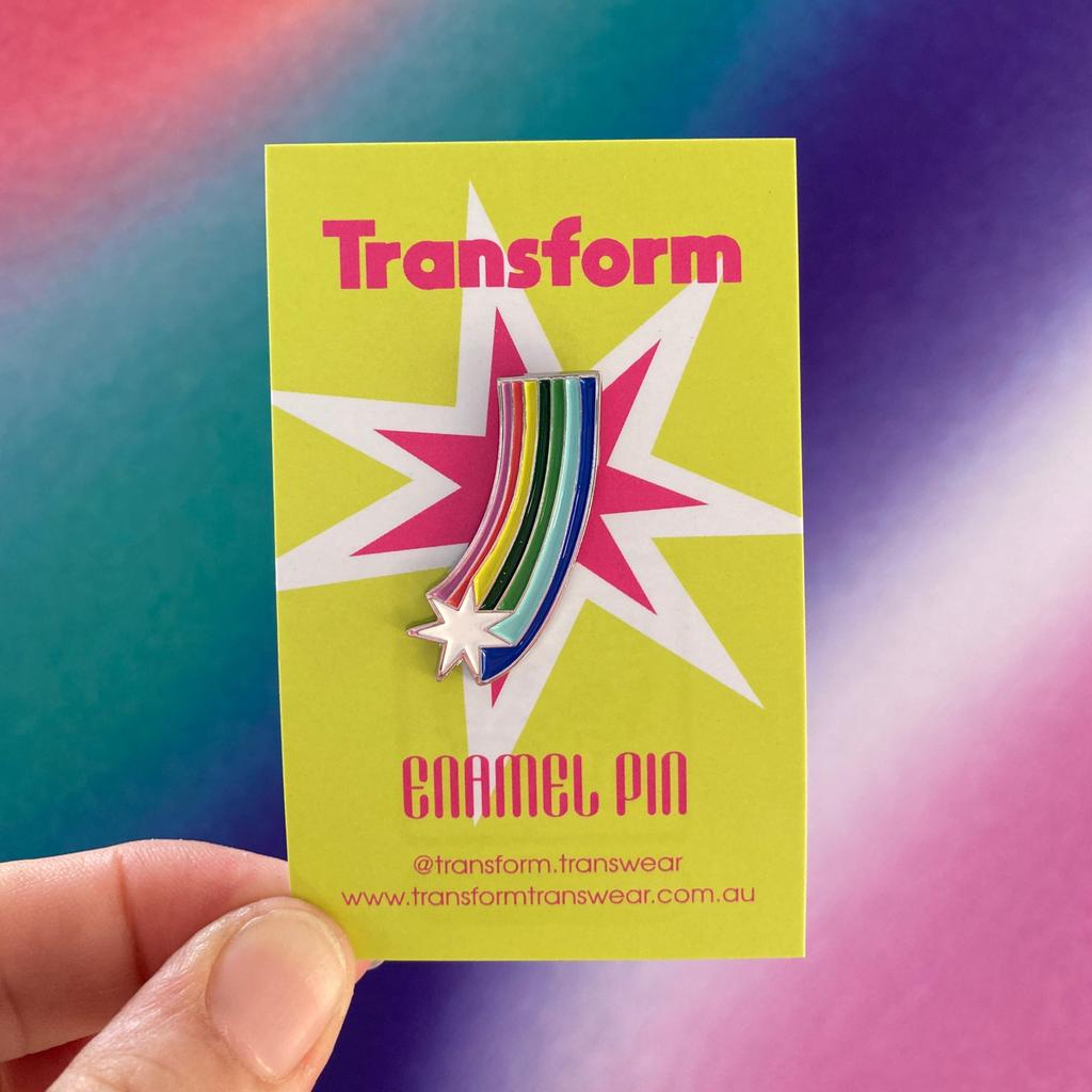 Image of a Pride Pin showing a shooting star and rainbow