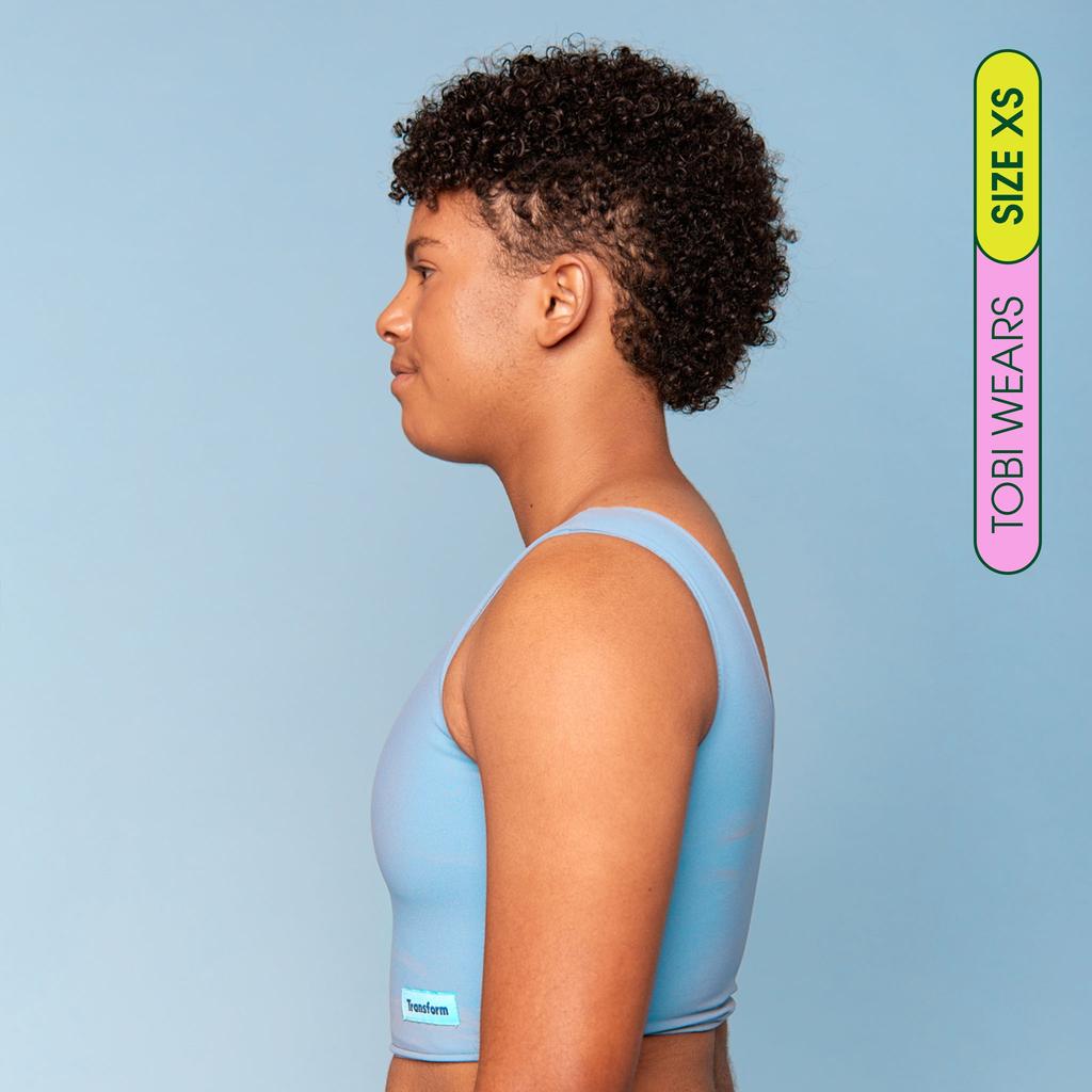 Tobi is wearing breathable Swim Binder  - side view showing flattening effect