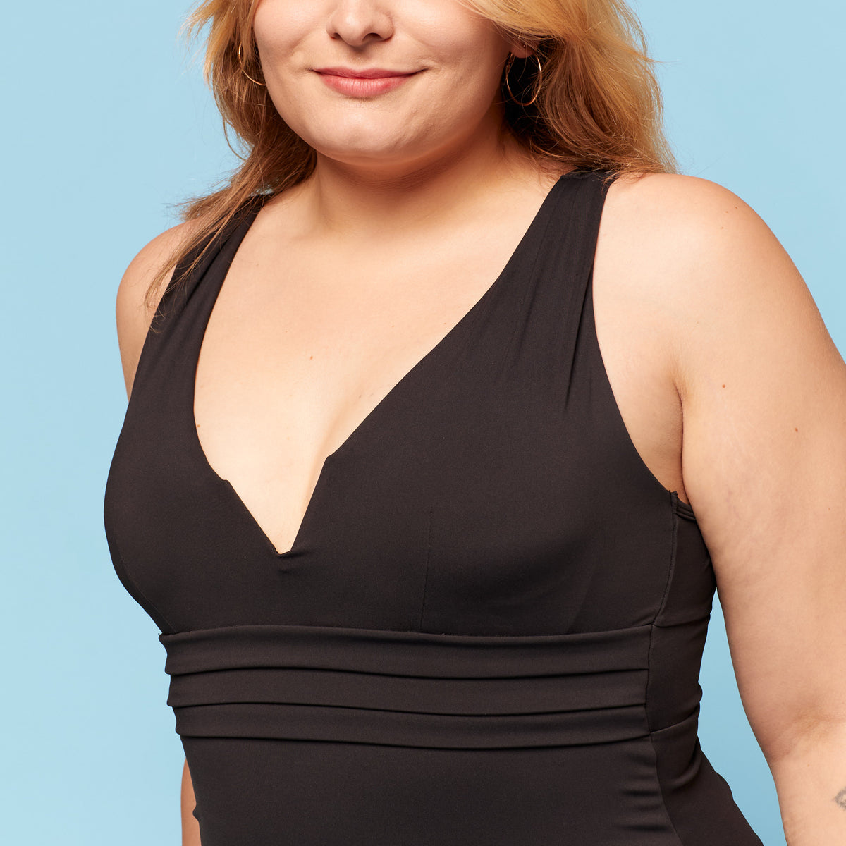 Model wearing trans femme tankini with padding