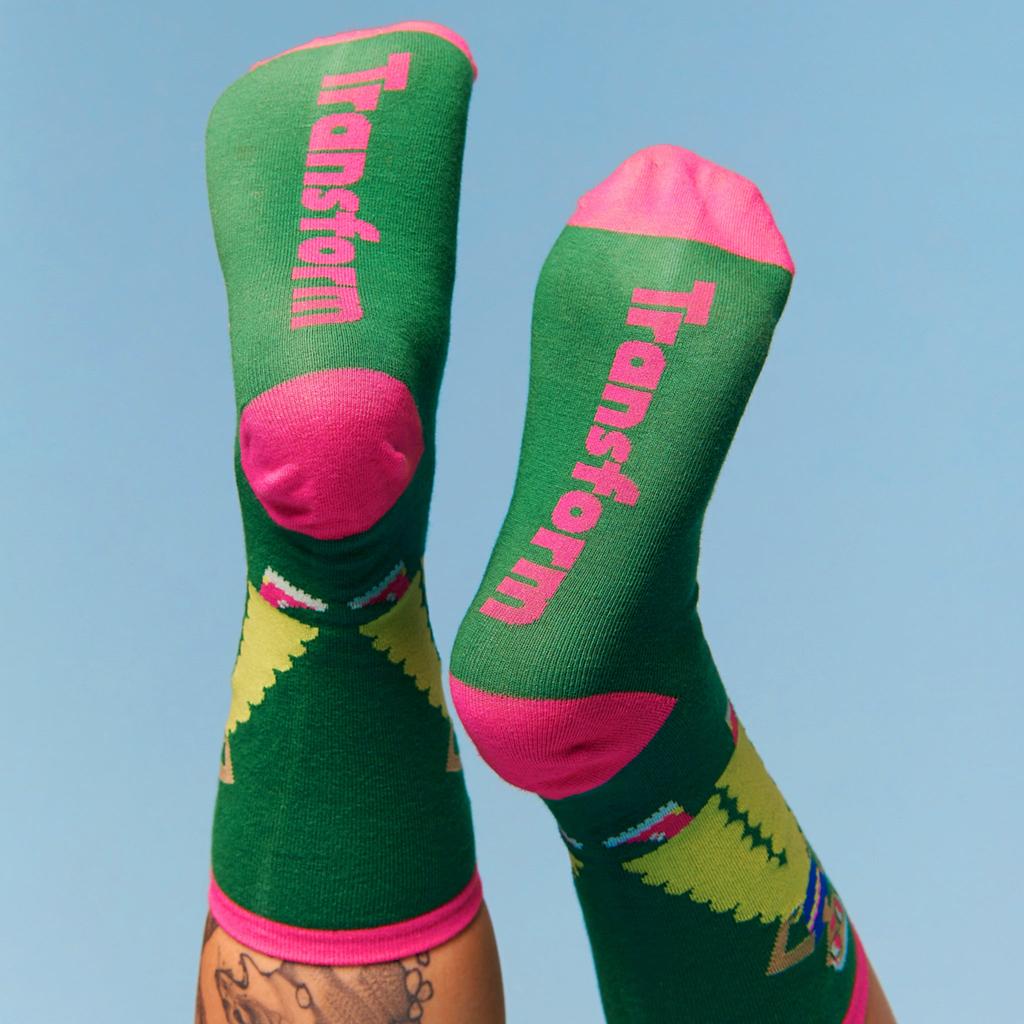 Model wearing a pair of pride socks