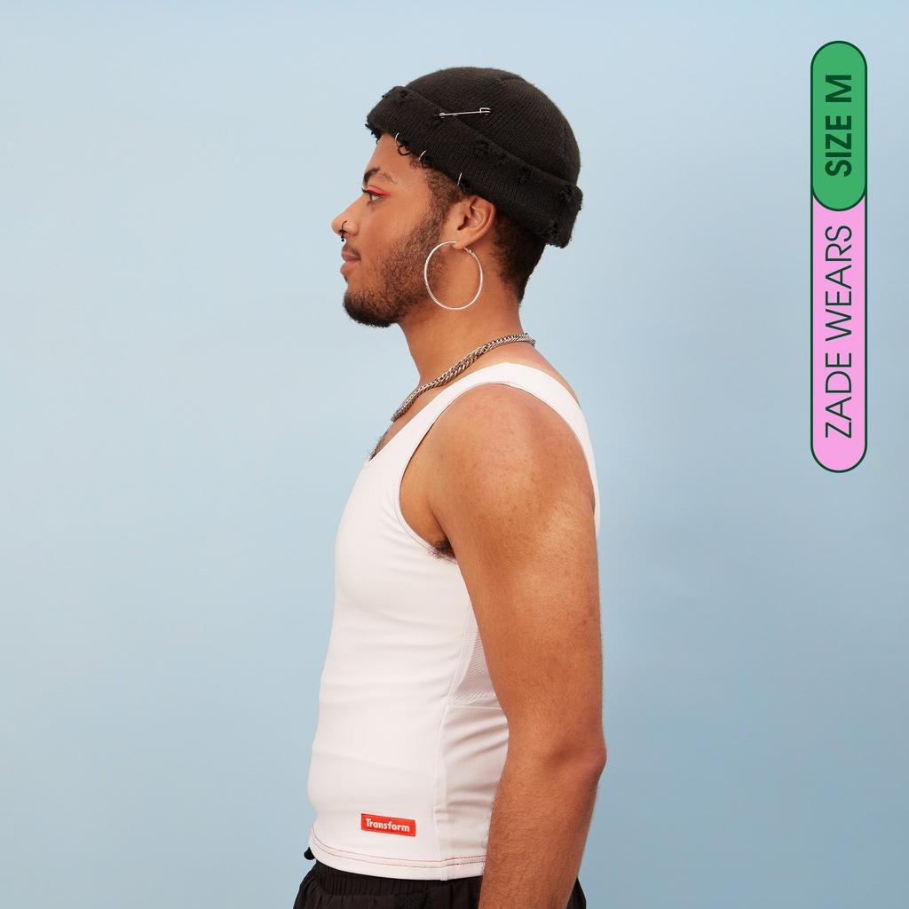 Zade wearing white, breathable chest binder tank - Side View of our Tank Binder showing flat chest
