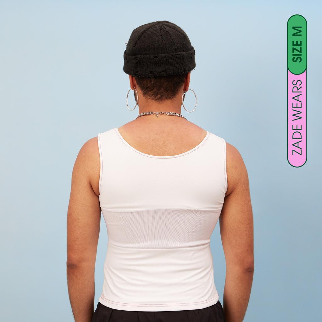 Zade wearing white, breathable chest binder tank - back view showing breathable panel