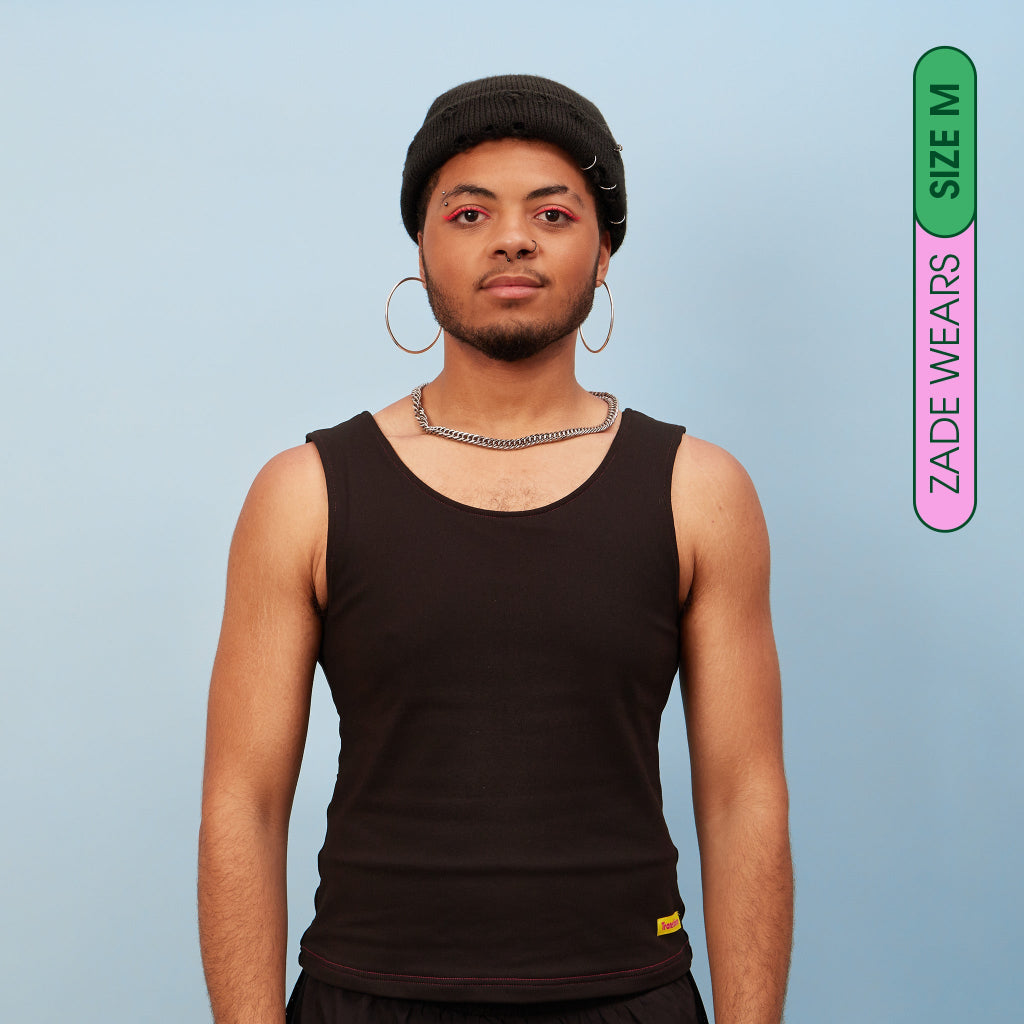 Zade wearing black, breathable tank chest binder - front view