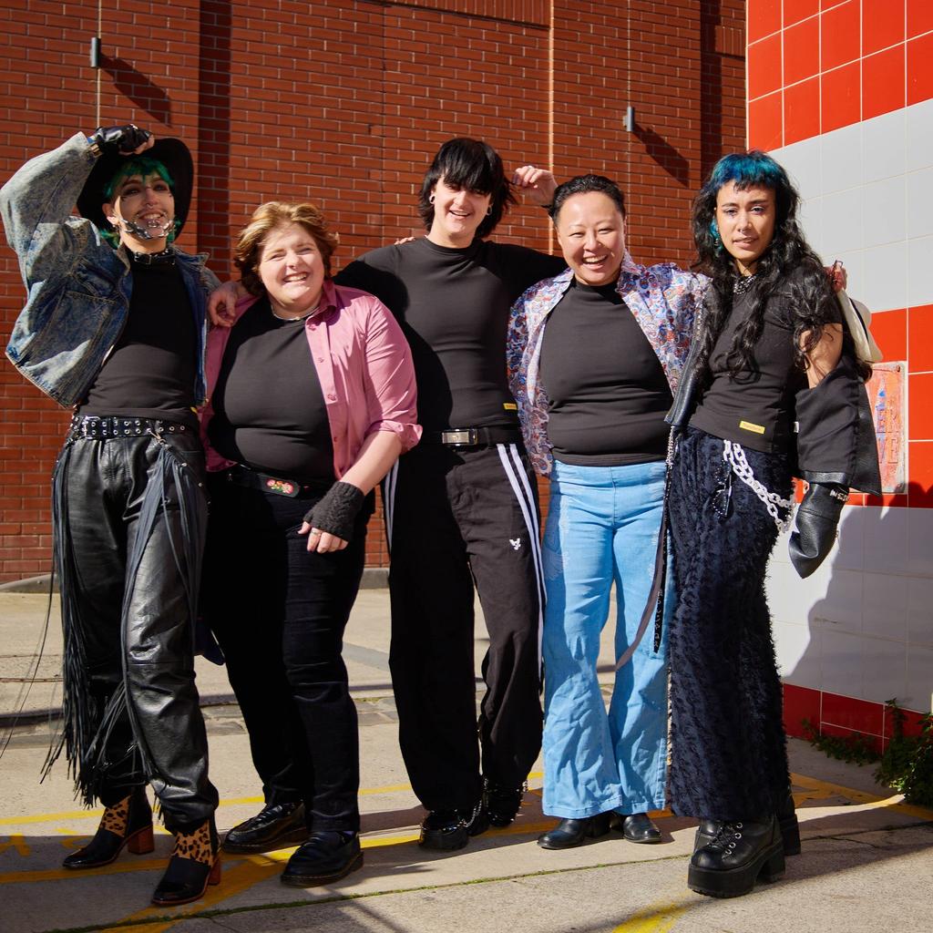 Size-inclusive models wearing compression shirts looking euphoric